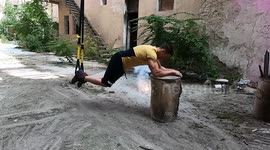Strong muscular guy workout with trx