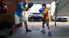 7year old boxer who loves to watch Mike tyson