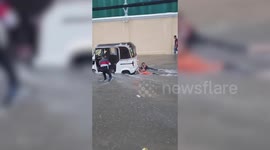 Kids go 'tuk-tuk' surfing on flooded road in Cambodia