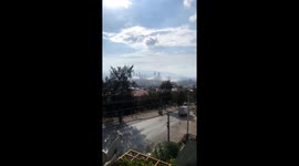 Plumes of dust rise from collapsed buildings in Turkish city Izmir after 7.0 earthquake