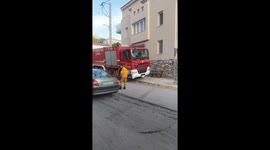 Firefighters ready to rescue woman from crumbling building