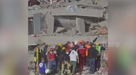Turkey Earthquake: rescuers search rubble of collapsed buildling