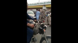 A car owner beating motorcycle rider while he ( car owner) was coming from the wrong side