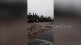 Super Typhoon Goni causes rivers to swell and flood surrounding homes
