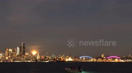 Watch as rare Blue Moon rises over Seattle as fishermen look on