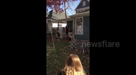 Americans celebrate Halloween amid pandemic by social distancing while trick-or-treating