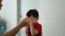 Funny toddler refuses to eat by playing 'PEEKABO' to cover his whole face