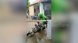Motorcycle Delivery Rider Drags Bike Under Metal Barrier