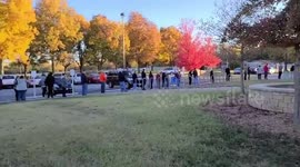 Americans wait in line to vote on historic election day