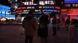 New Yorkers anxiously await results of historic election in Times Square