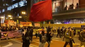 Wall of protesters march in Chicago to demand Trump leave office