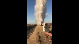 Mesmerizing wedding photoshoot finishes with plane dropping water on newlyweds
