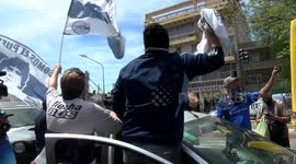 FILE: Argentine football fans gather outside clinic where Maradona recovered from brain surgery