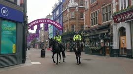 Police on horseback patrol deserted streets of London on first day of second lockdown