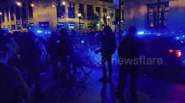 Chicago protester throws smoke bomb under police car during election protest