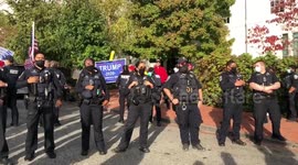 Members of Anonymous confront Trump supporters at RNC in Washington, D.C.