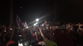 Crowd erupts in cheers as conspiracy theorist Alex Jones addresses protesters in Arizona