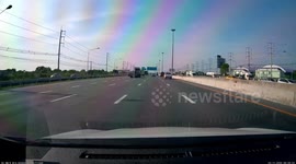 Car skids out of control and crashes into traffic barrier on motorway in Thailand