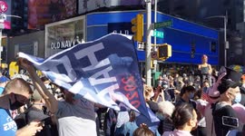 New Yorkers gather in Times Square to celebrate after Biden beats Trump to US presidency