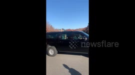 Trump exits from Trump National Golf Course and greets supporters