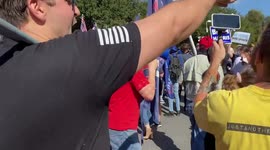 Trump supporter begins shouting at Biden supporters.