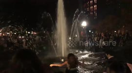 Girl in skirt at Washington Square Park Fountain