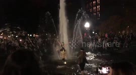 Overjoyed Biden fans leap into fountain in Washington Square Park in New York