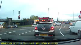 Van runs a red into traffic