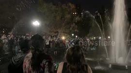 Biden supporters run through fountain in Washington Square Park during celebrations