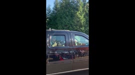 President Trump gives thumbs up to supporters as he leaves golf course for second day in a row