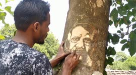 Man carves celebrities on tree trunks to raise awareness of deforestation in east India