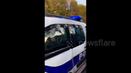 Students surround damaged police vehicle after clashes in Compiegne, France