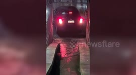 Motorist spends three minutes reversing on driveway so tight he has to climb out of the car boot