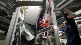 Chinese firefighters save motorist trapped in car hanging upside down in garage
