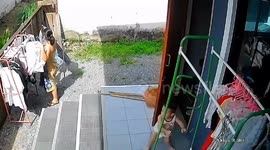 Toddler pulls over clothes rack while playing on patio