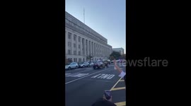 Biden supporters boo Trump motorcade on his way back from golf course