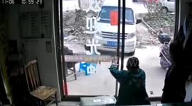 Elderly Chinese man luckily avoids injuries after driverless minibus smashes into shop
