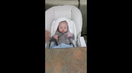Baby reacts to Parents trying to wake him