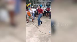 Girl's wacky skeleton dance amuses festival-goers in Thailand