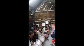 Nagaland Hornbill Festival - Natives drinking, eating, singing in their traditional huts
