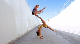 Circus acrobats perform crazy foot balancing trick