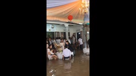 Wedding ceremony hosted as normal in deep floodwater in Vietnam