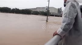Residents watch floodwaters rise as Typhoon Vamco hits Philippines