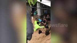 Moment emergency crews rescue newborn from flooded home after Typhoon Vamco