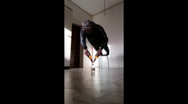 Russian fitness enthusiast completes press-ups balancing on glass bottles