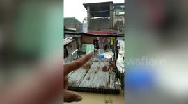 Typhoon Vamco traps residents on roofs as it batters Philippines