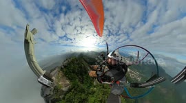 Watch this paraglider perform a flyby over Christ The Redeemer statue in Rio de Janeiro