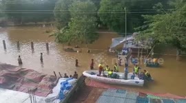 Police Distribute Bread To Residents Stranded In Typhoon Vamco Floods