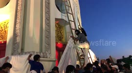 Thailand protest turns violent as crowds scuffle with police and climb monument