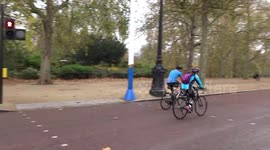 Flocks of cyclists on Pall Mall on Remembrance Sunday 2020  - London